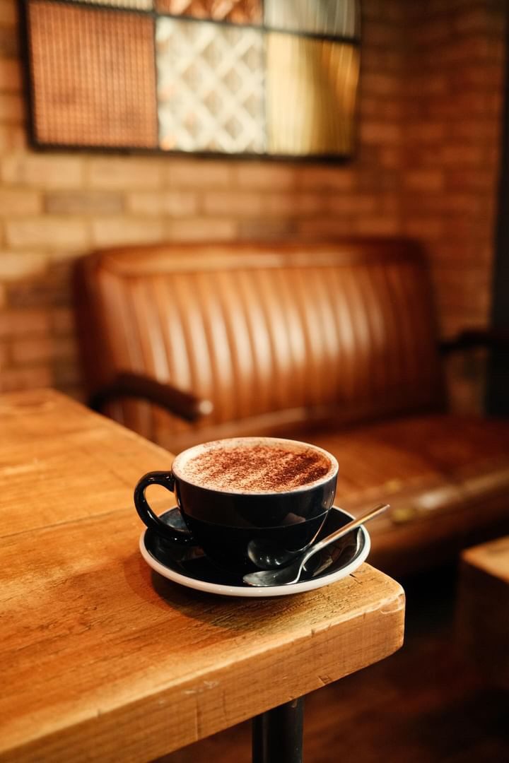 Coffee on the bench at Coffee Squared