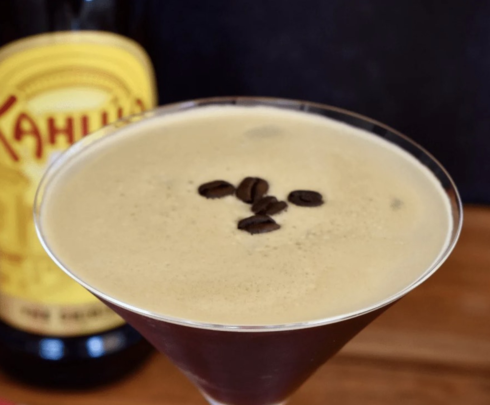 An espresso martini topped with coffee beans